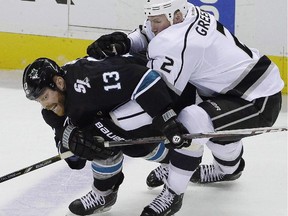 San Jose Sharks' Raffi Torres, left, battles Los Angeles Kings' Matt Greene. The NHL has suspended Torres 41 games for interference and an illegal check to the head to Anaheim Ducks forward Jakob Silfverberg.