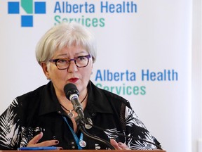 In this June 8, 2015 file photo, Alberta Health Services president and CEO Vicky Kaminsky speaks in Calgary at the announcement of AHS's Patient First Strategy to improve care delivery.