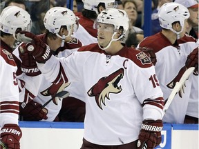 Right-winger Shane Doan (19) celebrates a goal with his Arizona Coyotes teammates. The Oilers take on the Coyotes Thursday.