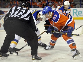 Edmonton Oilers centre Ryan Nugent-Hopkins wins a faceoff against David Backes of the St. Louis Blues at Rexall Place in an NHL game at Rexall Place on Oct. 15, 2015.