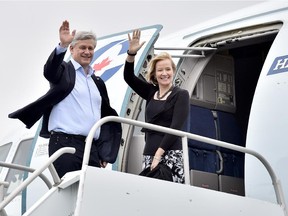 Conservative leader Stephen Harper and his wife Laureen Harper arrive on their campaign plane in St. John's. N.L., on Saturday, October 3, 2015.