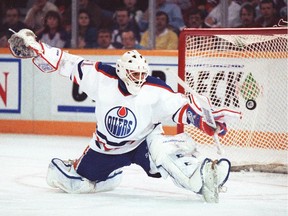 Grant Fuhr does the splits and makes a blocker save in a game against Detroit. February 22, 1991.