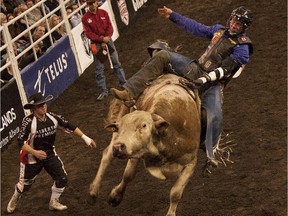 Tyler Thomson hangs on during the bull riding at the 2014 Canadian Rodeo Finals. The future of the event in Edmonton is up in the air.