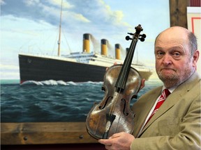 Auctioneer Alan Aldridge of auctioneers Henry Aldridge & son holds the violin of Wallace Hartley, the instrument he played as the band leader of the Titanic, on the 101st anniversary of the sinking of the ship, April 15, 2013 in Devizes, England.  The auction house, which specializes in Titanic memorabilia, spent seven years proving the violin was genuine and belonged to Wallace Hartley, who with his orchestra, famously played on as the ship sank in April 1912, and were among the 1,500 who died. Long thought to have been either lost at sea or stolen, it is being described as one the most important pieces of Titanic memorabilia that has ever come up for sale.