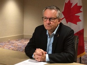 Trade Minister Ed Fast speaks to reporters in Atlanta on Oct. 2, 2015 where he negotiated the Trans-Pacific Partnership agreement.