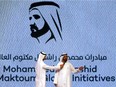 Sheikh Mohammed bin Rashid al-Maktoum, Prime Minister of the United Arab Emirates (UAE) and ruler of Dubai (R) addresses an audience on October 4, 2015 during the launch event of his humanitarian initiative "Mohammed Bin Rashid al-Maktoum Global Initiative" in Dubai. The initiative will target over 130 million people over the coming ten years focusing its programs on spreading knowledge, combating poverty, empowering communities and innovation for the future in the Arab region.