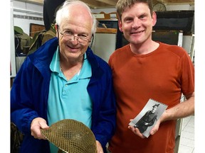 Retired Edmonton doctor Doug Armstrong, with Dutch collector Erik Zwiggelaar, holds the helmet belonging to his father, featured in an upcoming episode of War Junk.