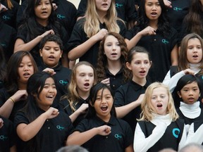A student choir from from Monsignor Fee Otterson School sing at a mass celebrating Edmonton Catholic Schools's 125th anniversary in 2013.