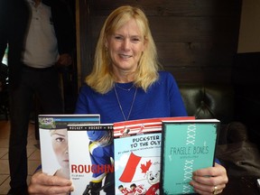 Children's booth author Lorna Schultz Nicholson with some of her titles.