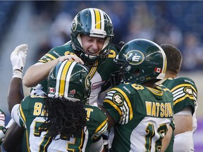 Edmonton Eskimos' Sean Whyte (6) celebrates with Anthony Barrett (73) and Cory Watson (18) a last-second win against the Blue Bombers in Winnipeg on Saturday, Oct. 3, 2015.