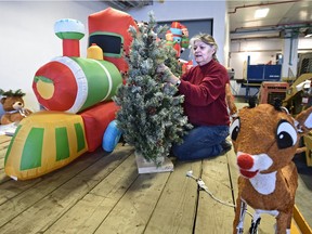 Lynette Maurice, designer for Zuma, assembling a Canadian Tire float for the first outdoor Santa Parade in Edmonton, November 20, 2015.