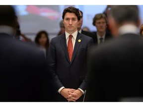 Prime Minister Justin Trudeau takes part in a moment of silence, to remember the victims of Friday's Paris attacks, at the start of a plenary session at the G20 Summit in Antalya, Turkey on Sunday, Nov. 15, 2015.