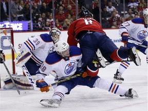 The Oilers started their longest road trip of the season in Washington on Monday, Nov. 23, with a 1-0 loss. Capitals left wing Alex Ovechkin (8), from Russia, falls over Edmonton defenceman Brandon Davidson (88) with Oilers goalie Anders Nilsson (39) during the game.