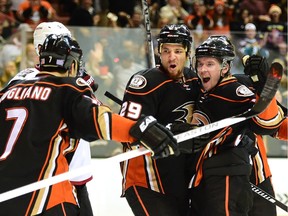 Sami Vatanen (45) of the Anaheim Ducks celebrates a goal with Chris Stewart (29) and Andrew Cogliano (7) during NHL action against the Arizona Coyotes on Nov. 9, 2015.