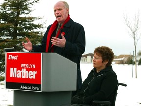 Liberals Kevin Taft, left, and Weslyn Mather campaign in November 2004.