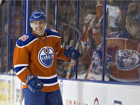 Edmonton Oilers' Brandon Davidson (88) celebrates a goal against the Calgary Flames during second period NHL action in Edmonton, Alta., on Saturday, Oct. 31, 2015.