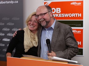 Alberta Premier Rachel Notley and Bob Hawkesworth are all smiles as they greet NDP supporters at Bob Hawkesworth's campaign office during the summer byelection campaign. Notley is under fire for appointing Hawkesworth as executive director of the premier’s southern Alberta office at the McDougall Centre in Calgary.