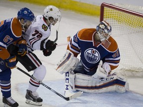 Chicago Blackhawks Artemi Panarin (72) celebrates a goal on Edmonton Oilers goalie Anders Nilsson (39) as Benoit Pouliot (67) watches during second period NHL action on November 18, 2015, in Edmonton.