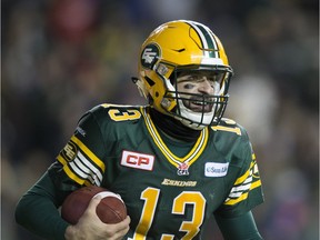 Edmonton Eskimos quarterback Mike Reilly (13) celebrates after scoring a touchdown against the  Calgary Stampeders during second half CFL Western Final action on November 22, 2015 in Edmonton.