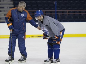 Edmonton Oilers' Jordan Eberle talks to coach Todd McLellan during practice at Rexall Place on Nov. 5, 2015, in Edmonton.