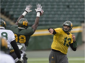 Six-foot-six defensive end Willie Jefferson blocks a Mike Reilly pass during an open Eskimos scrimmage for fans Saturday at Commonwealth Stadium.