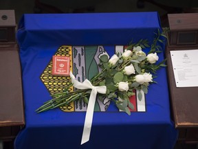 A memorial for Manmeet Bhullar sits on his work station at the Alberta Legislature in the Chamber. Bhullar was killed in a highway collision between Calgary and Edmonton.