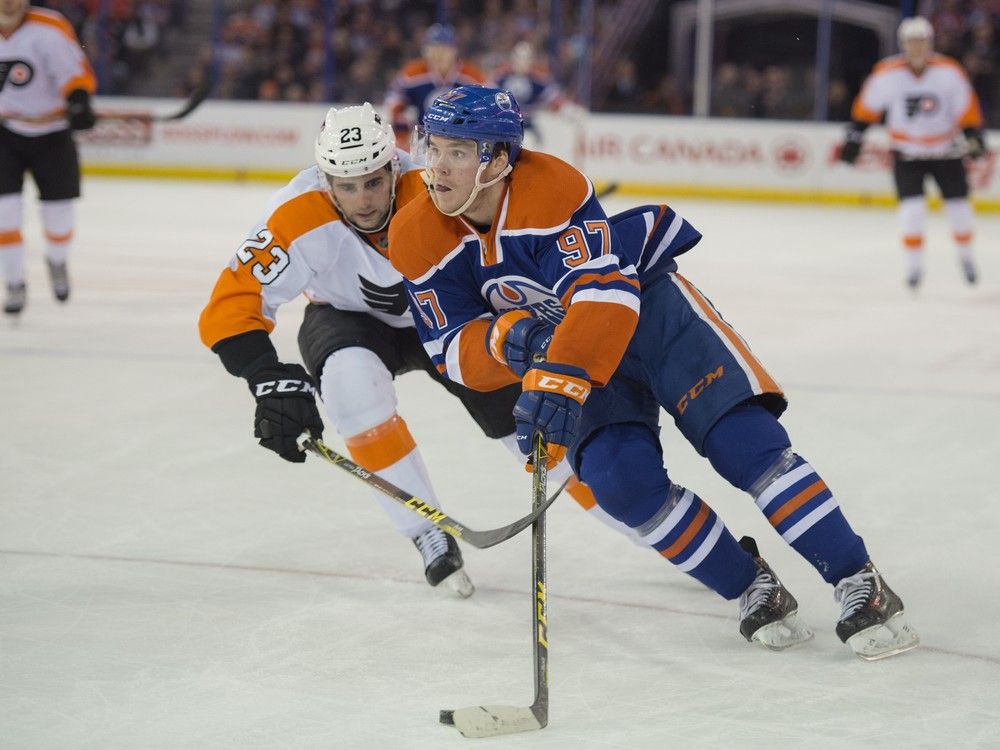 Oilers forward Matt Hendricks shows off shattered cup after taking