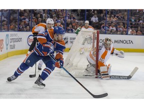 Taylor Hall of the Edmonton Oilers, tries a wraparound on Michal Neuvirth of the Philadelphia Flyers at Rexall Place.