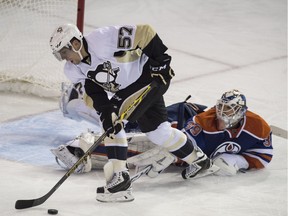 Oilers goalie Anders Nilsson takes a third period penalty on David Perron of the Pittsburgh Penguins at Rexall Place in Edmonton on Friday.