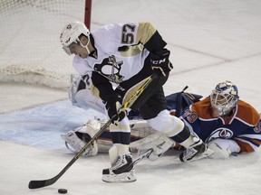 EDMONTON, AB. NOVEMBER 6,  2015 - Anders Nilsson  of the Edmonton Oilers, takes a penalty on David Perron of the Pittsburgh Penguins at Rexall Place in Edmonton. Shaughn Butts / Edmonton Journal ******EDMONTON SUN OUT**********