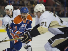 Oilers forward Jordan Eberle makes a move on Pittsburgh's Evgeni Malkin during his first game of the season on Friday, Nov. 6, in Edmonton.