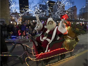 Santa sings to the crowd during Santa's Parade of Lights on Nov. 21, 2015 in Edmonton.