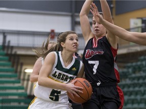 University of Alberta Pandas' Jessilyn Fairbanks drives the paint against the University of Winnipeg Wesmen's Megan Noonan on Nov. 13, 2015, at the Saville Centre. The Pandas won 70-52.