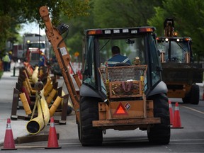 EDMONTON, ALBERTA AUGUST 7, 2015: Workers put in a new 12 inch gas pipeline for ATCO Gas on 115Av-139St in Edmonton on Friday Aug. 7, 2105. (photo by John Lucas/Edmonton Journal)(standalone)