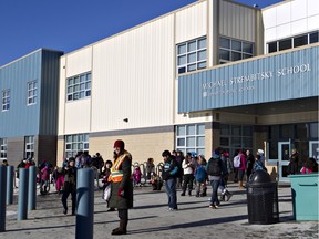 Students leave classes for the day at Michael Strembitsky School in Edmonton.