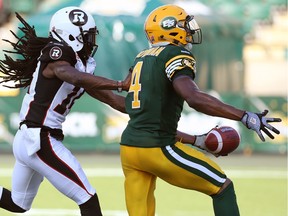 Edmonton Eskimos' Adarius Bowman runs for a touchdown as Ottawa Redblacks' Abdul Kanneh chases him during a game in Edmonton on July 9, 2015. The Eskimos won the game 46-11.