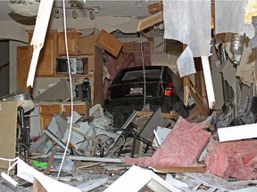 A Jeep Patriot SUV crashed through a home at 4605 154th Avenue  before coming to rest in the attached garage at the front of the house  on May 11, 2015.