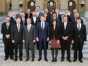 Alberta Wildrose Party Leader Brian Jean and members of his caucus pose for a photograph on the front steps of the Alberta Legislature on May 11, 2015.