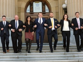 Alberta Wildrose Leader Brian Jean is flanked by members of his caucus as they descend the front steps of the Legislature on May 11, 2015.