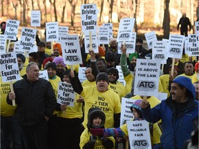 Taxi drivers take part in a rally at the provincial legislature in advance of a debate at City Hall about a new bylaw affecting taxis and ride-sharing services on Nov. 16, 2015.