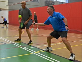 From left, Don Hunter and Ron Strank play pickleball at the Terwillegar rec centre.