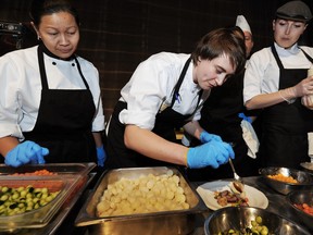 Chef Doreen Prei works on her dish at the Canadian Culinary Championship's Gold Medal Plates  in October 2013.