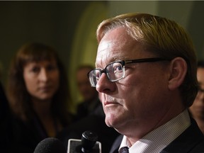 Education Minister David Eggen speaks to media after meeting with members of the Catholic School Board at the Legislature in Edmonton on Wednesday Sept. 23, 2015.