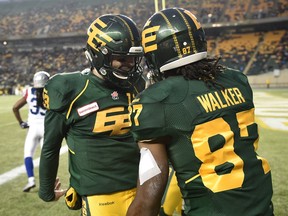 Edmonton Eskimos wide receiver Derel Walker celebrates one of his three touchdown catches against the Montreal Alouettes on Nov. 1, 2015, at Commonwealth Stadium with quarterback Mike Reilly. They were both named CFL players of the week on Nov. 4.