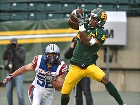 Edmonton Eskimos rookie wide receiver Derel Walker makes a touchdown catch behind Montreal Alouettes' Nicolas Boulay during a Canadian Football League game at Commonwealth Stadium on Nov. 1, 2015.