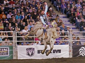 Caleb Bennett rides Virgil in the bareback riding event at the Canadian Finals Rodeo at Rexall Place in Edmonton on November 12, 2015.