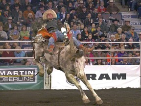 Kevin Langevin rides OLS Tubs Ross River in the bareback riding event at the Canadian Finals Rodeo at Rexall Place in Edmonton on November 12, 2015.