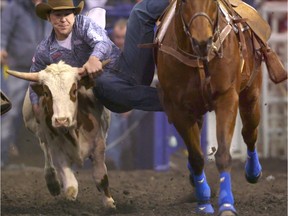 Morgan Grant competes in the steer wrestling event on Day 2 of the Canadian Finals Rodeo at Rexall Place in Edmonton on November 12, 2015.