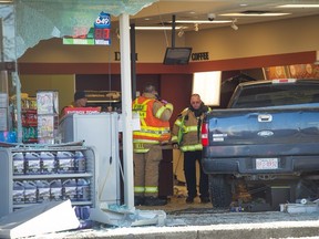 Four people were injured Wednesday when a truck crashed into a Petro-Canada store at 97th St. and 118th Ave.