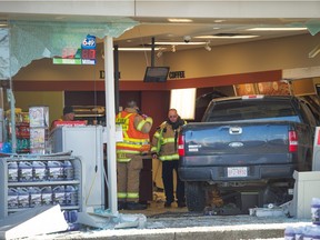 A pickup truck smashed through the front of the Neighbours convenience store at 97 Street and 118 Avenue in Edmonton on November 18, 2015.